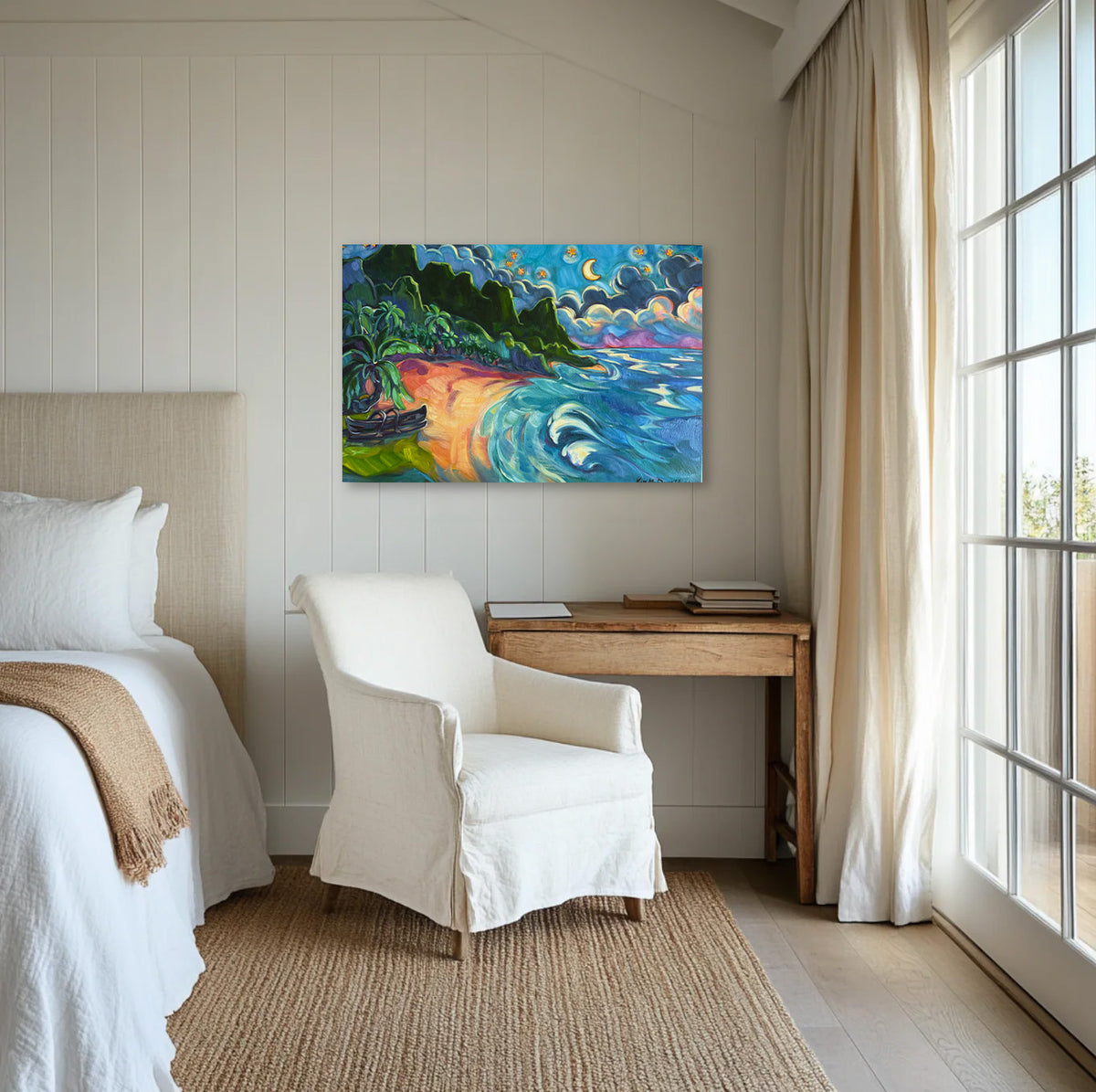 A colorful abstract landscape painting of a beach and ocean waves hangs on a white paneled wall in a bright, modern bedroom with a white armchair, wooden desk, and large window.